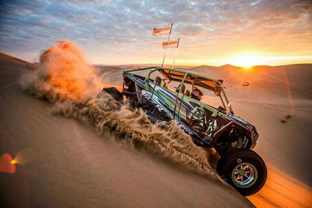 Polaris buggy on red dunes in Dubai